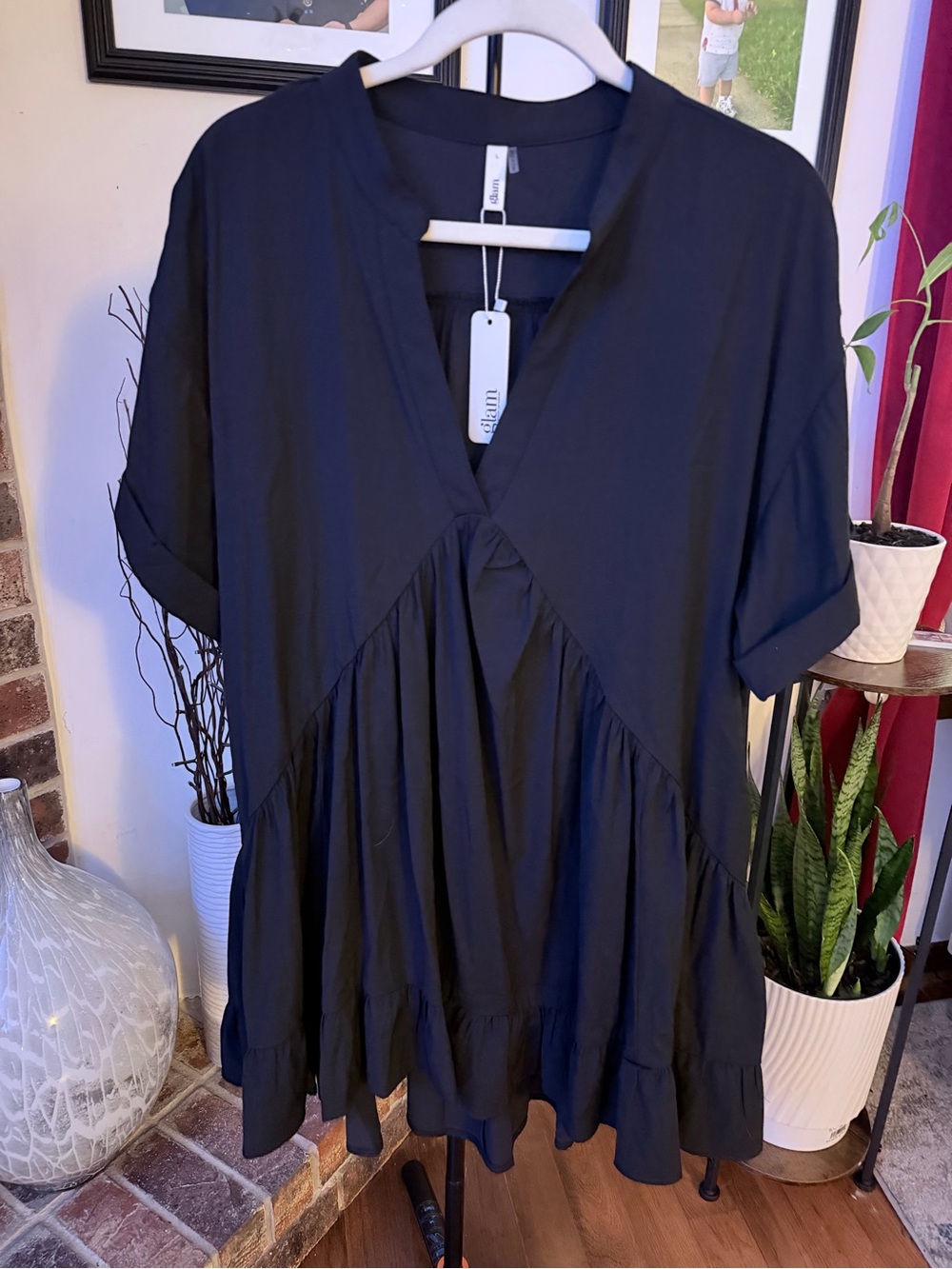 glamorous short black V-neck dress with cuffed short sleeves